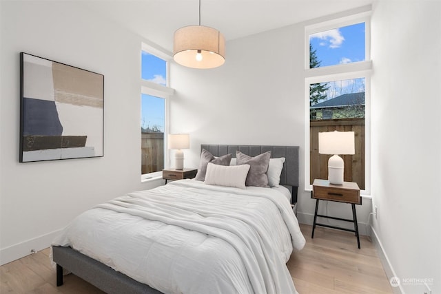 bedroom with light hardwood / wood-style flooring