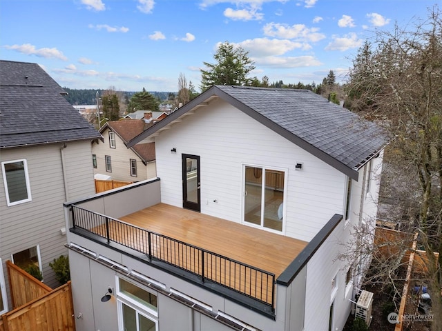 back of house with a balcony