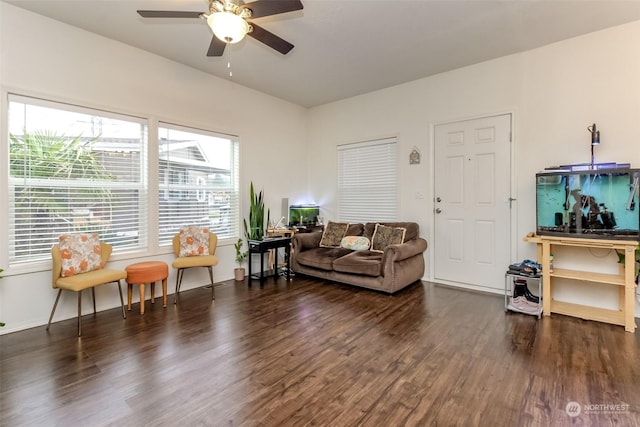 living room with dark hardwood / wood-style floors and ceiling fan