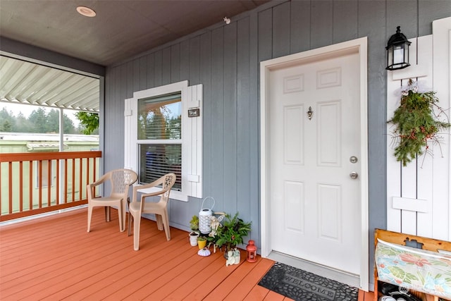 doorway to property with covered porch