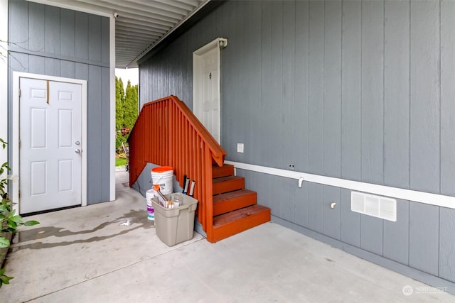 entrance to property featuring a patio