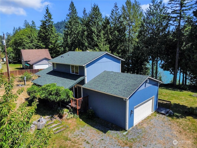 exterior space featuring a garage and a front yard