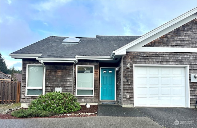 single story home featuring a garage