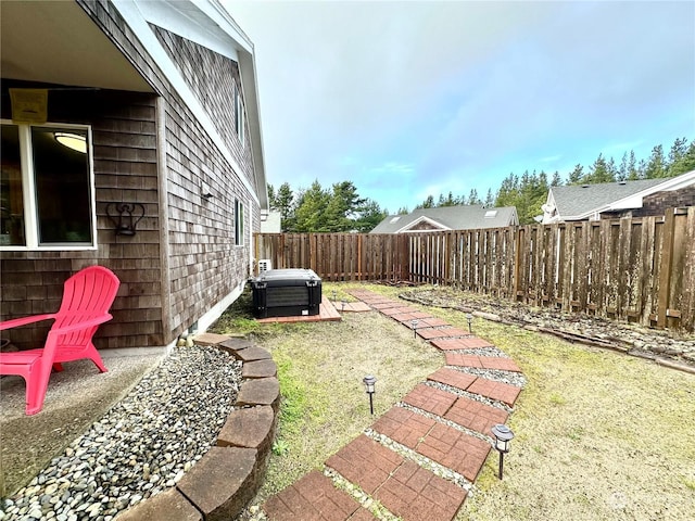 view of yard featuring a patio and central AC