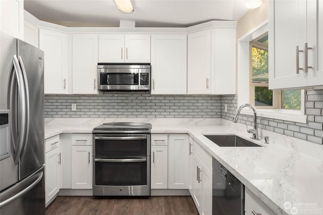 kitchen featuring white cabinetry, appliances with stainless steel finishes, and sink