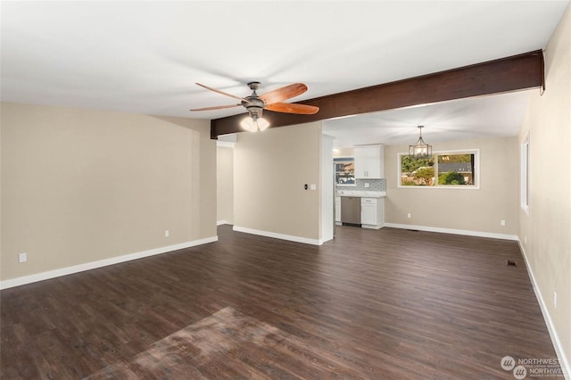 unfurnished living room with beamed ceiling, dark hardwood / wood-style floors, and ceiling fan