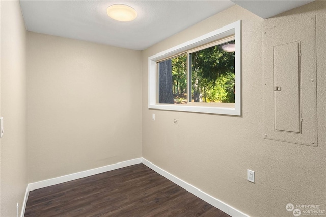 empty room with dark wood-type flooring