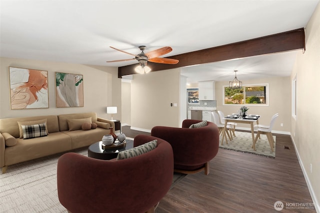 living room featuring beam ceiling, hardwood / wood-style flooring, and ceiling fan