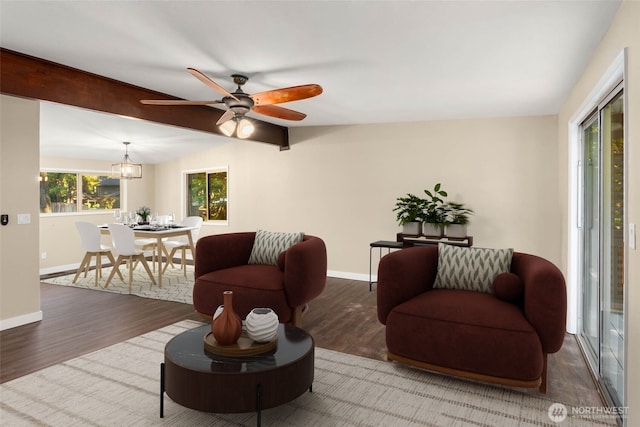 living room with lofted ceiling with beams, wood-type flooring, and ceiling fan