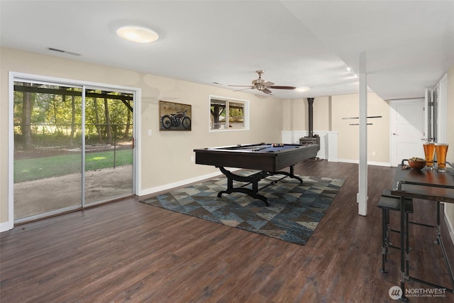 rec room featuring ceiling fan, a wood stove, pool table, and dark hardwood / wood-style flooring