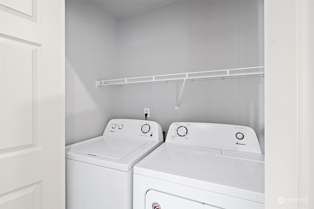 washroom featuring independent washer and dryer