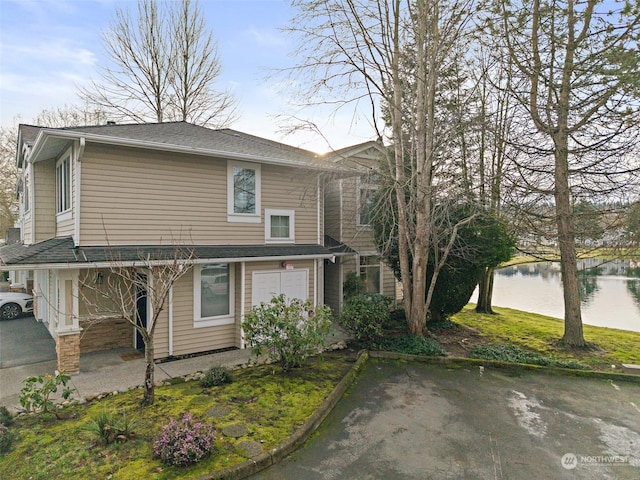 view of front of house featuring a water view