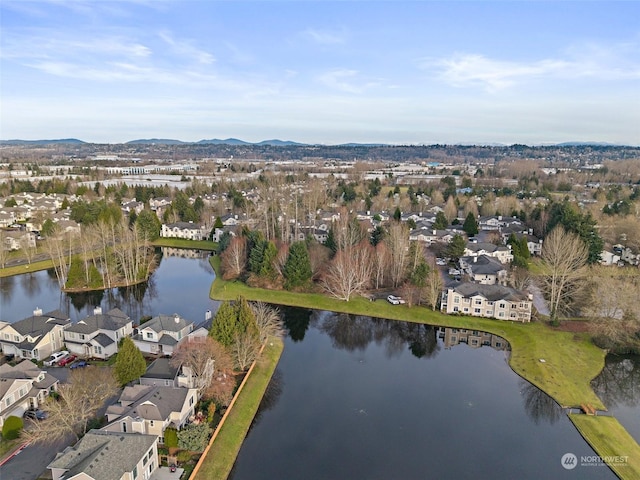 birds eye view of property featuring a water and mountain view