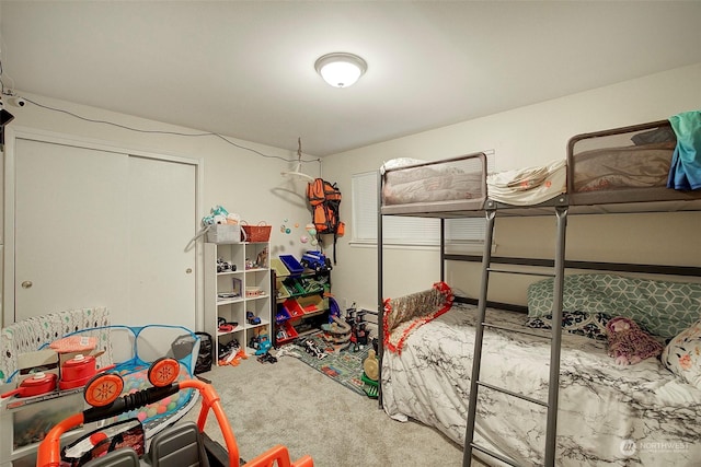 bedroom with a closet and carpet floors