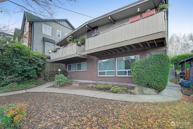 back of house featuring a balcony