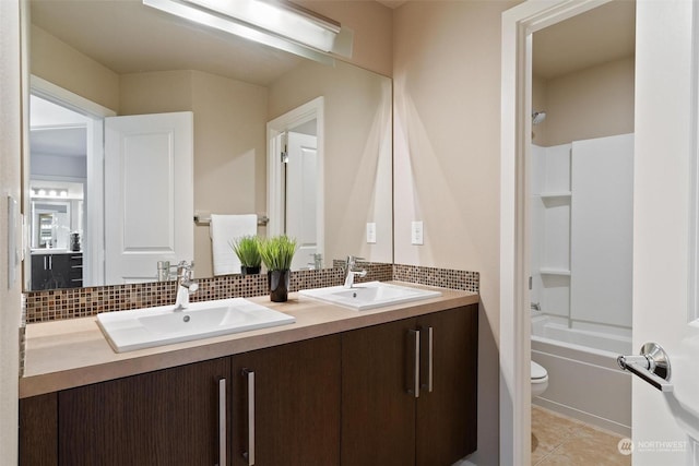 full bathroom featuring tasteful backsplash, tile patterned flooring, vanity, and toilet