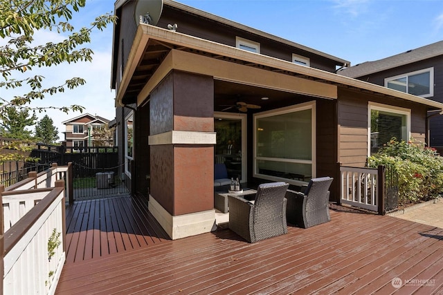 wooden terrace featuring ceiling fan