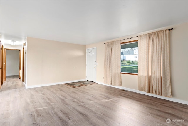 empty room with wood-type flooring