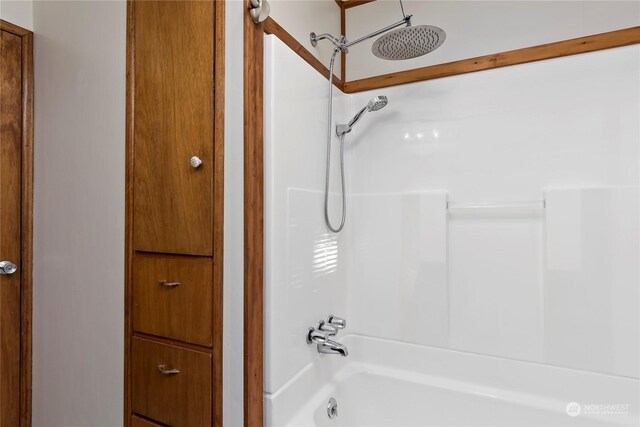 bathroom with shower / washtub combination