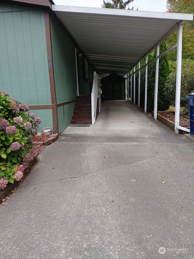 view of parking / parking lot with a carport