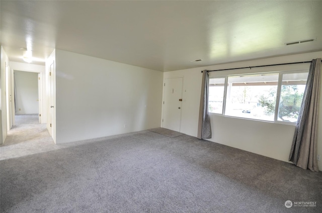 spare room with light colored carpet