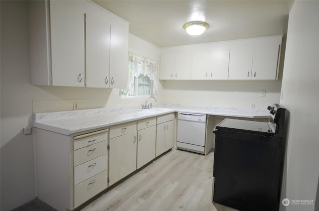 kitchen with dishwasher, white cabinets, black / electric stove, and sink