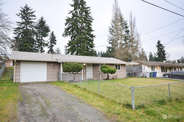 ranch-style house with an outbuilding, a garage, and a front lawn