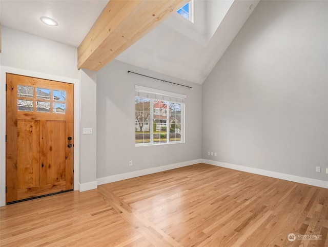 entryway with high vaulted ceiling, beamed ceiling, and light hardwood / wood-style flooring