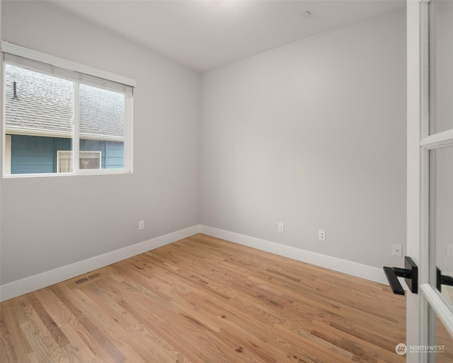 unfurnished room featuring light wood-type flooring