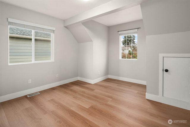 bonus room with light hardwood / wood-style flooring