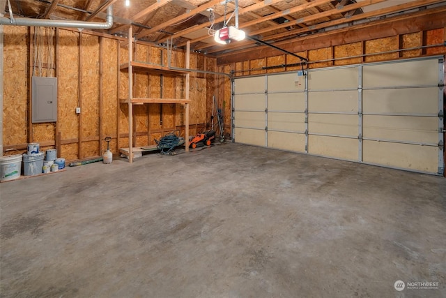 garage with electric panel and a garage door opener