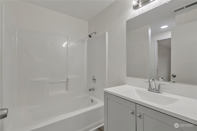 bathroom featuring vanity and shower / washtub combination