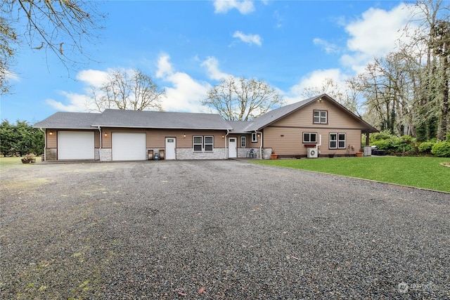 view of front of house with a garage and a front yard