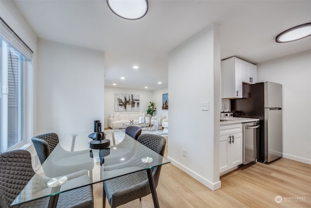 dining space featuring light hardwood / wood-style floors