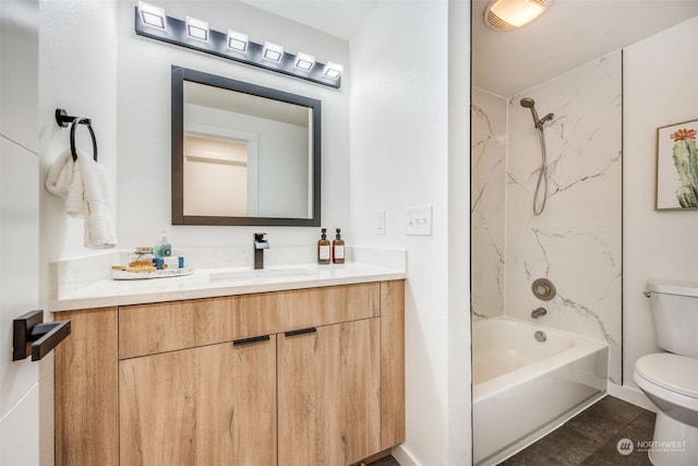 full bathroom featuring tile patterned flooring, vanity, toilet, and tiled shower / bath