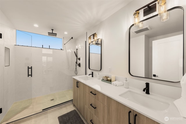 bathroom featuring tile patterned flooring, vanity, and an enclosed shower