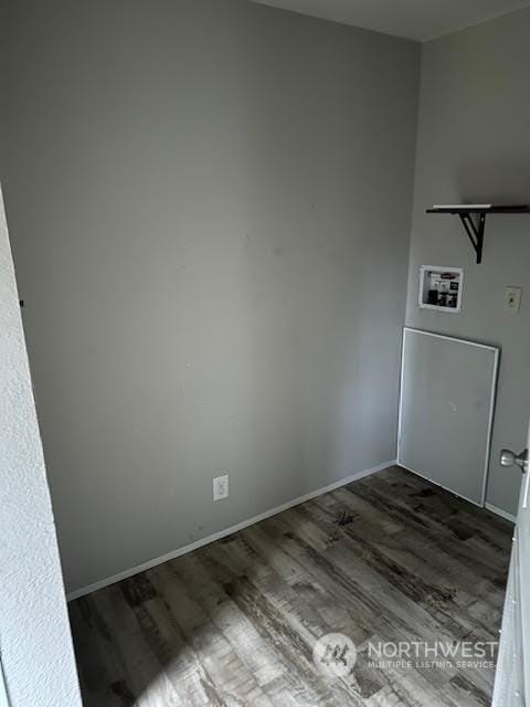 unfurnished room with dark hardwood / wood-style floors