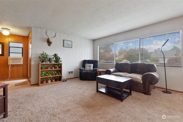 carpeted living room with wooden walls and cooling unit