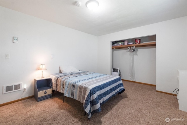 carpeted bedroom featuring a closet