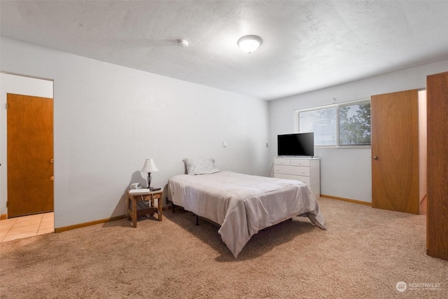 carpeted bedroom featuring a textured ceiling