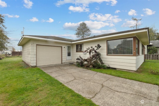 ranch-style house with a garage and a front lawn