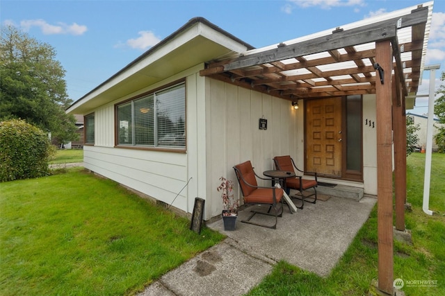view of side of home featuring a lawn