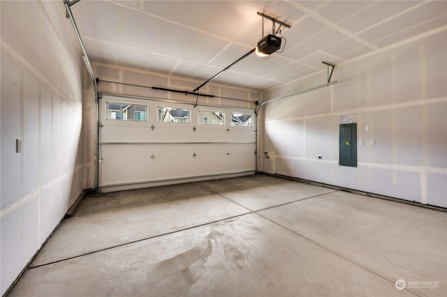 garage featuring a garage door opener and electric panel