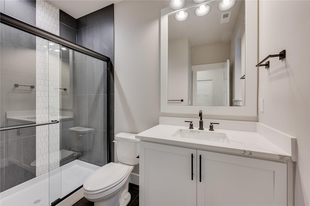 20239 125th Ave NE Unit Sm2-11, Bothell, WA 98011 - full bathroom with toilet, visible vents, a shower stall, and vanity