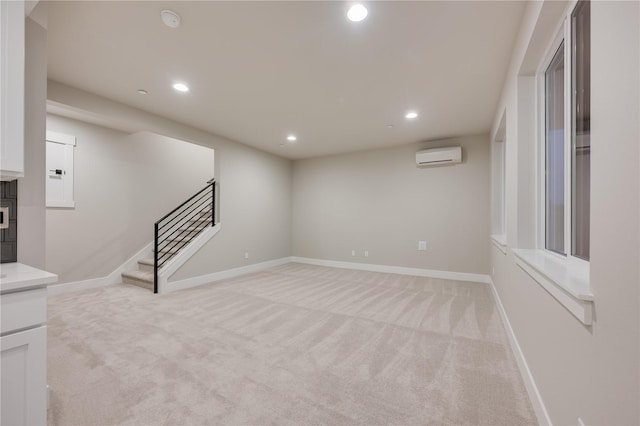 20239 125th Ave NE Unit Sm2-11, Bothell, WA 98011 - below grade area featuring an AC wall unit, recessed lighting, stairs, and light colored carpet
