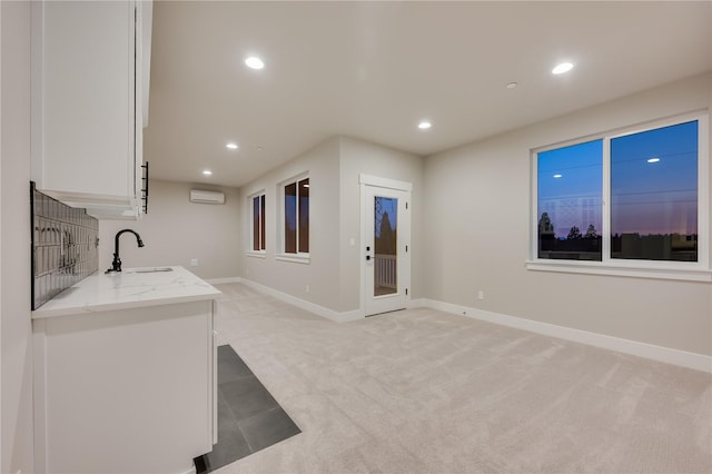 20239 125th Ave NE Unit Sm2-11, Bothell, WA 98011 - unfurnished living room featuring recessed lighting, a wall mounted AC, light carpet, and a sink