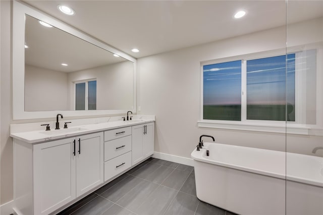 20239 125th Ave NE Unit Sm2-11, Bothell, WA 98011 - bathroom featuring double vanity, baseboards, a sink, and tile patterned flooring