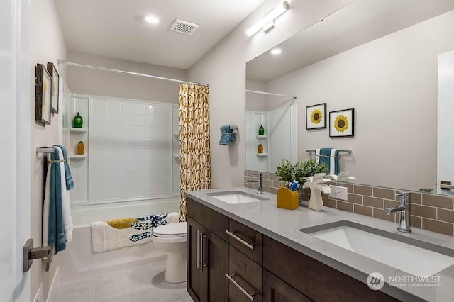 full bathroom featuring shower / bath combination with curtain, tasteful backsplash, vanity, tile patterned flooring, and toilet