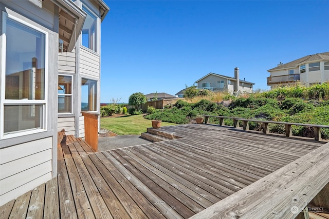 wooden deck with a yard