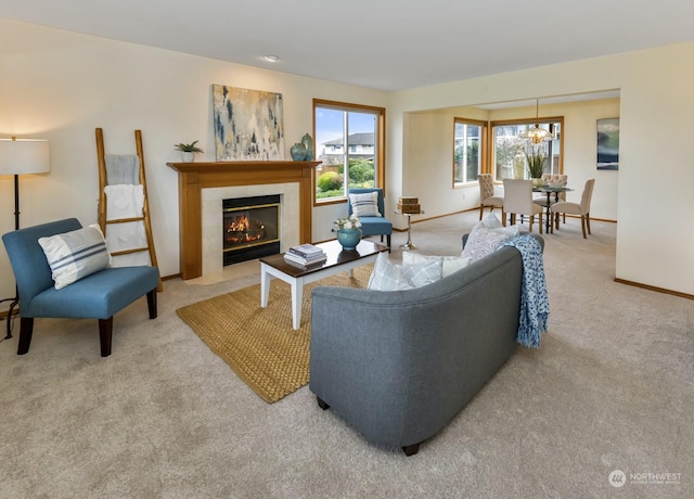 carpeted living room featuring a tiled fireplace